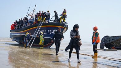 Passengers of an illegal immigration boat attack a fisherman